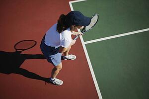 Woman plays tennis