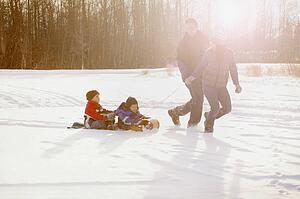Family goes tobogganing