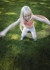 Child plays with hoop
