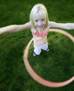 Child plays with hoop