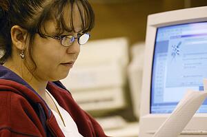 Woman reads paper