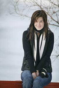 Woman sits outside