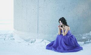 A woman with a blue gown