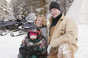 A family with ski-doos