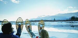 A couple with snowshoes