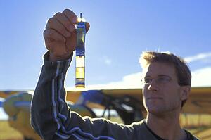 Pilot checking fluid levels