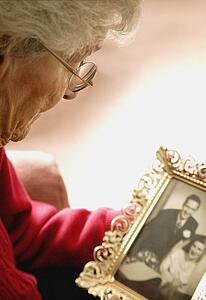 Woman holds a photo