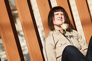 Woman squints at sunlight