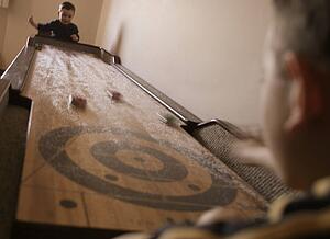 Playing a shuffleboard game