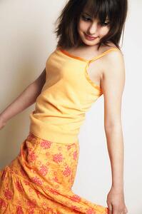 A girl twirls skirt