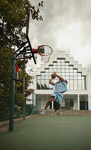 Man plays basketball