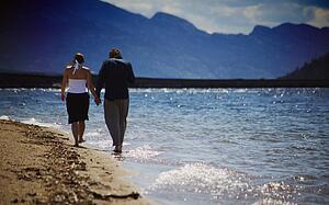 Couple walks on the beach