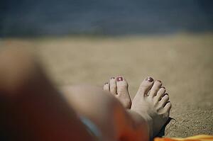 A woman's feet on a beach