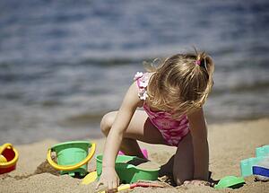Child playing in the sand