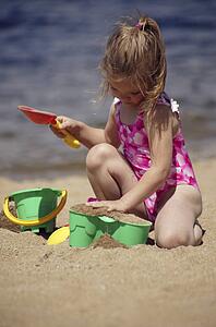 Child playing in the sand
