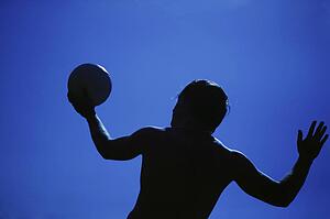 A man serving a volleyball