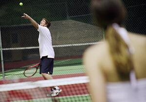 A couple playing tennis