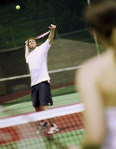 A couple playing tennis