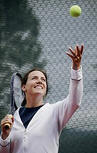 A woman playing tennis