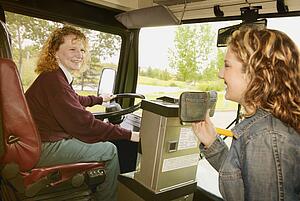 Woman boards a public bus