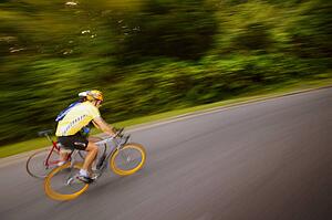 Two people racing on bikes