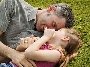 Father and daughter playing together