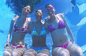 Underwater portrait of three young women
