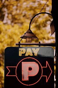 A sign directing patrons to pay