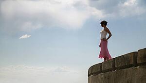 Woman stands on the edge
