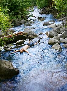 Laying in a stream