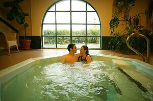 Happy couple in hot tub