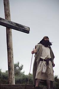 Man stands at the foot of the cross