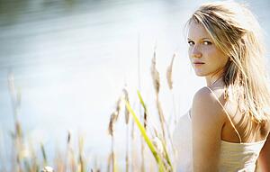Young woman glancing over her shoulder