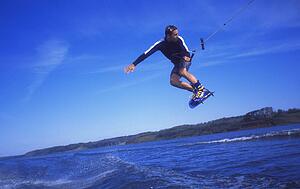 Man wakeboarding on coal Lake Alberta Canada