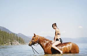 Woman on a horse in the water