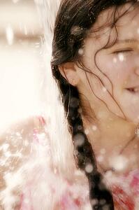 Child enjoys getting wet