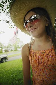 Teen with a hat and sunglasses