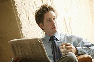 Businessman with newspaper