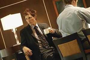 Businessman drinks coffee