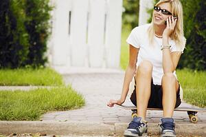 Skater talks on the phone