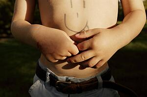 Child with drawing on his chest
