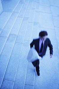 Businessman walks quickly