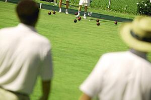 People lawn bowling