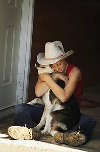 Girl hugging her dog