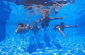 Family group in swimming pool