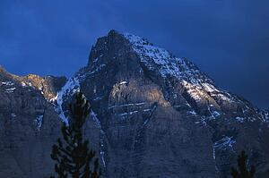 Mountain against dark sky