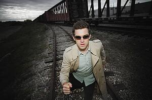 Man runs alongside a train