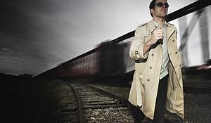 Man runs alongside a train