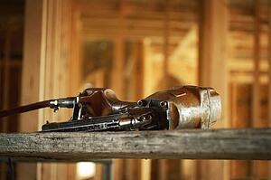 Nail gun inside house under construction