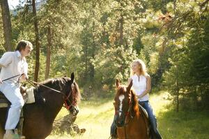 Man and woman on horseback